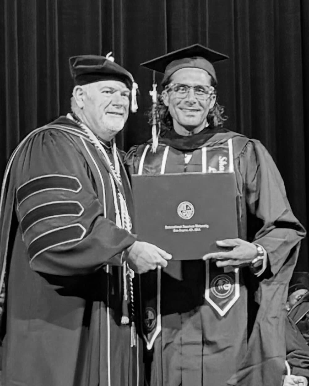 Ehsan Kaykhah in academic regalia at the 2026 commencement ceremony, Los Angeles
