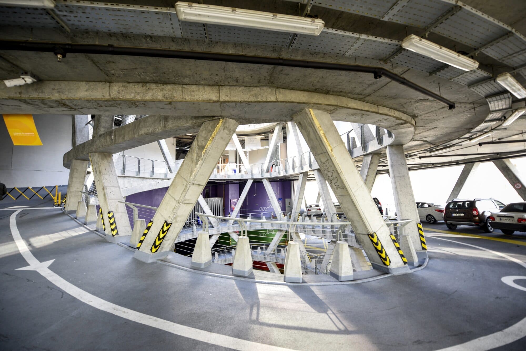 The hall seen the length of its concrete arches, the exhibitor route running away under them