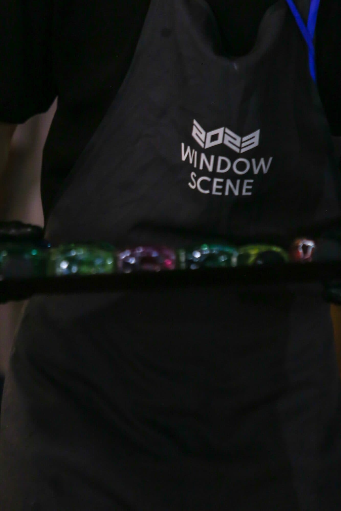 The WINDOW SCENE apron worn by the hospitality crew