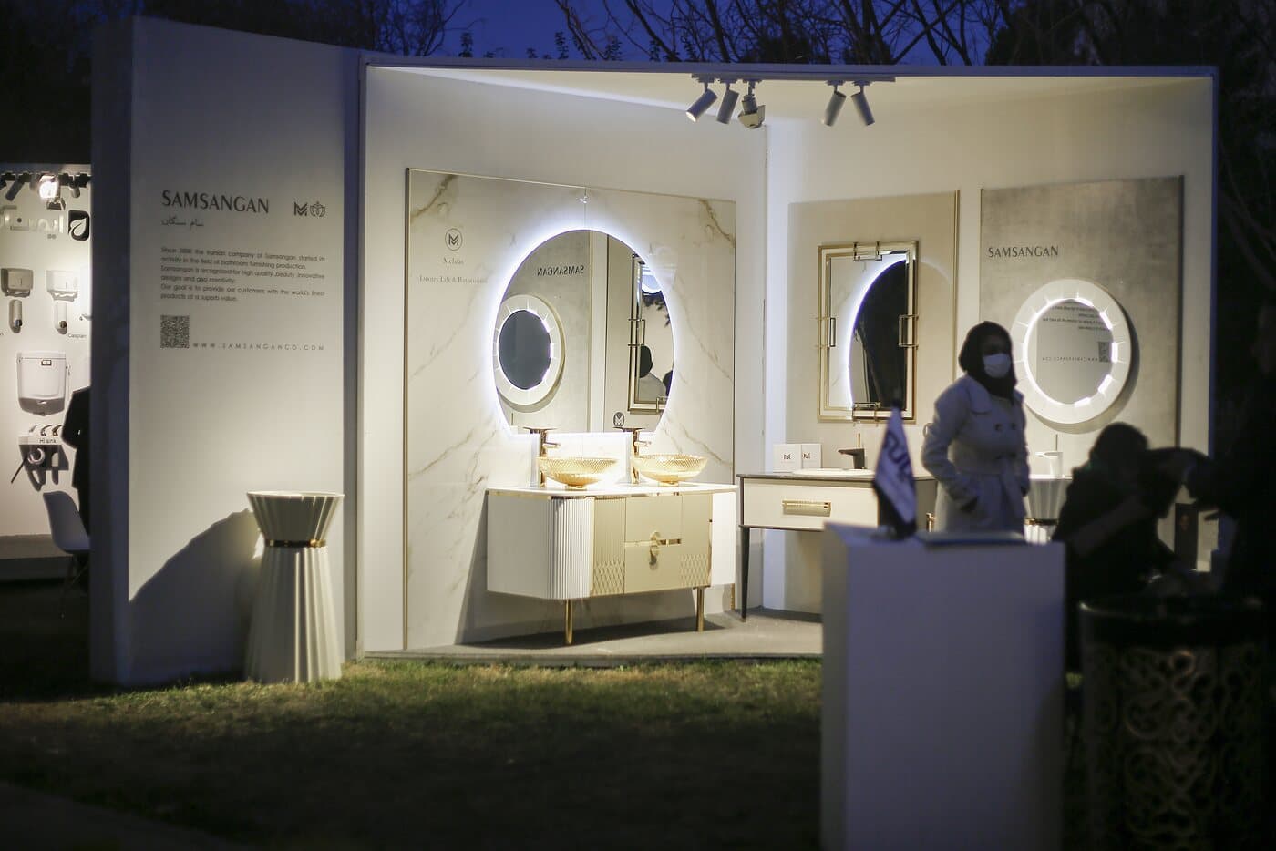The SAMANGAN setting lit at dusk, round mirrors above the basins — WINDOW GARDEN, Mashhad 2021